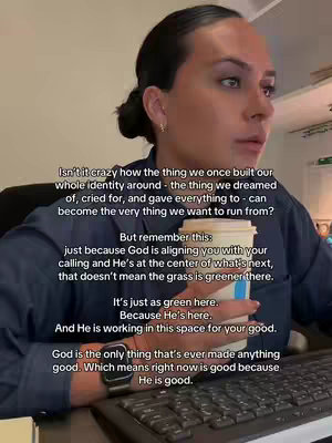 A woman sits in an office setting, facing slightly to the side, with text overlaid on the image. She is holding a coffee cup and looking towards her right. The background includes a desk, a keyboard, and some office furnishings.