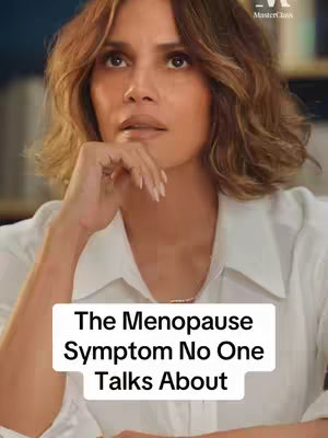 The cover image features Halle Berry looking thoughtful, with her hand supporting her chin. She appears to be in a well-lit indoor setting. A text overlay at the bottom reads "The Menopause Symptom No One Talks About".