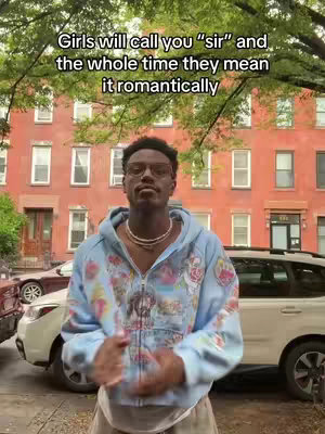The cover image shows a young man in a light blue zip-up hoodie standing in front of a building with a red brick facade. Text overlayed on the image says: "Girls will call you \"sir\" and the whole time they mean it romantically."