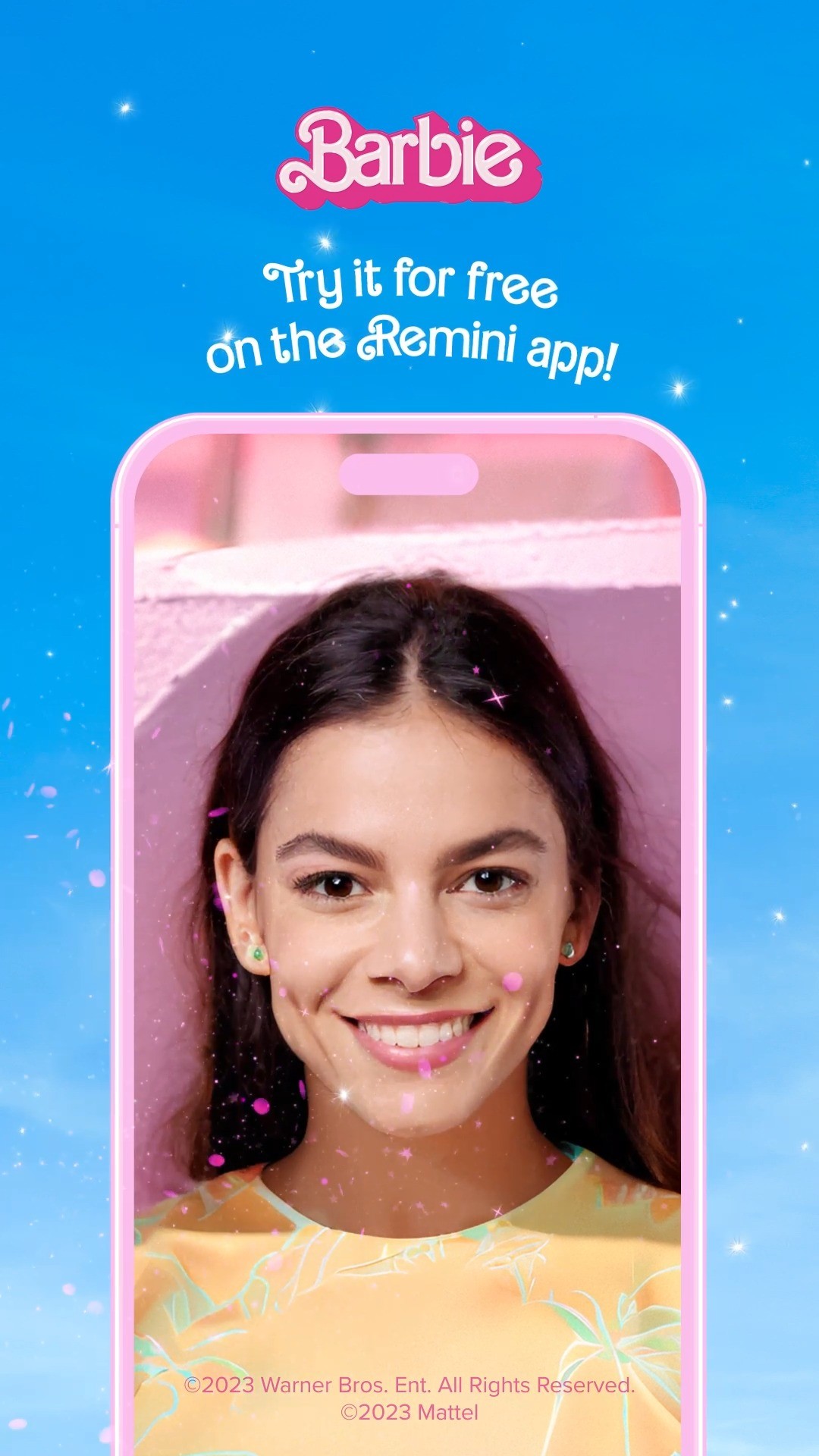 A vertical image featuring a person's face framed within the interface of a phone, set against a blue sky background filled with small, shining stars and overlaid with a pink filter. The phone frame is a pale pink hue, and the person's face is centered, with several pink sparkle effects. Above the phone are the words "Barbie" in pink, stylized script. Below, the image contains the text "Try it for free on the Remini App". The background transitions from a bright blue at the top to a slightly lighter shade closer to the phone screen, with the sparkle effect and the top left of the frame.