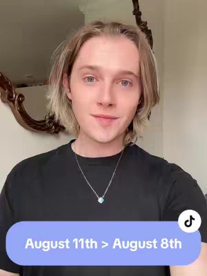 A young man with blonde hair looks at the camera, with text overlaid over a colored bar at the bottom of the screen.