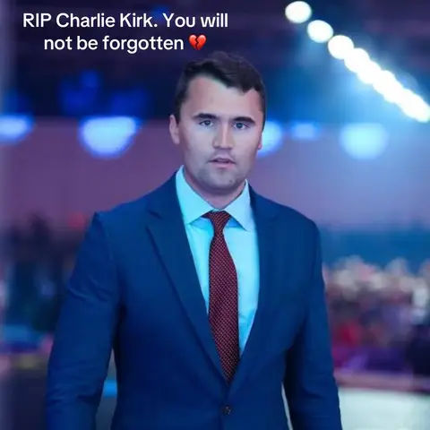 The cover image features a man in a blue suit and red tie, centered against a blurred background with blue and purple hues. The composition is a medium shot, focusing on the man's upper body. Text overlay is present at the top of the image.