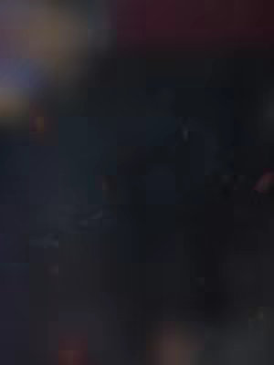 The cover image is dark and abstract, with a blurred background suggesting a mix of dark and lighter colors.