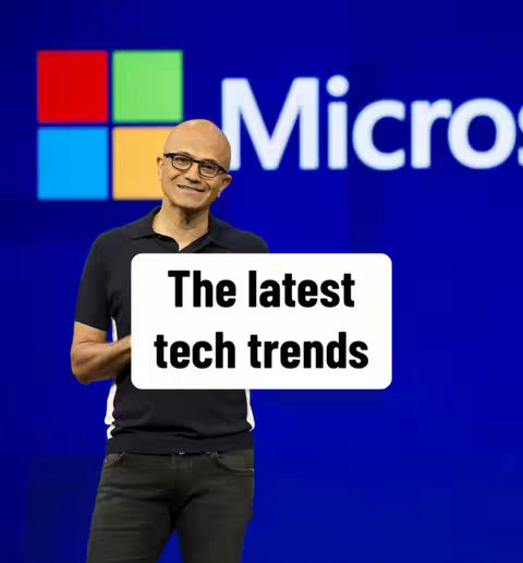 The cover image features a man standing in front of a backdrop featuring the Microsoft logo. He is holding a sign that says, 'The latest tech trends.' He is bald, wearing glasses, and has a black shirt and dark jeans.