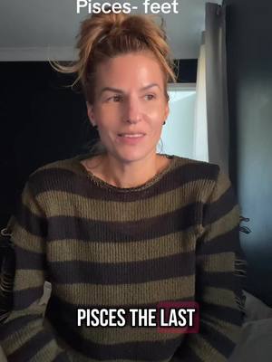 The cover image shows a woman with light skin and brown hair pulled up in a messy bun. She is wearing a green and black striped sweater. The image is taken from the chest up, and she is looking to the side with a neutral expression. Text overlays at the top and bottom of the image.