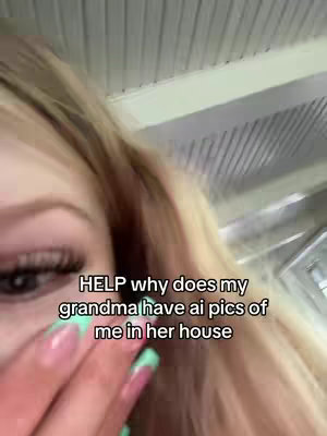 A selfie-style shot focused on the upper part of a young woman’s face, with her eye and some of her blonde hair visible on the left side of the frame. She is touching her face near her eye, with long, painted fingernails. Text overlayed on the image reads, "HELP why does my grandma have ai pics of me in her house."