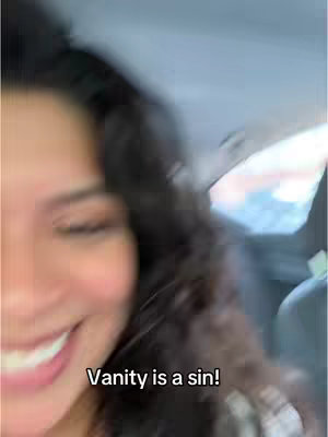 The cover image shows a woman smiling in a car. The text overlay reads "Vanity is a sin!"