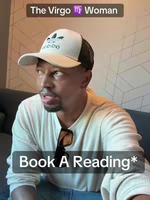 A man wearing a white Adidas cap and a white sweater poses looking sideways. Overlaid text: 'Book A Reading*'.