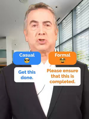 A man in a suit is centered in the frame, with two colored rectangles overlaid. The blue rectangle states 'Casual' and displays a sunglasses emoji, while the orange rectangle says 'Formal' and has a glasses emoji. Below these, two speech bubbles contain different phrasing for instructions. The background is blurred, suggesting a light-filled office environment.