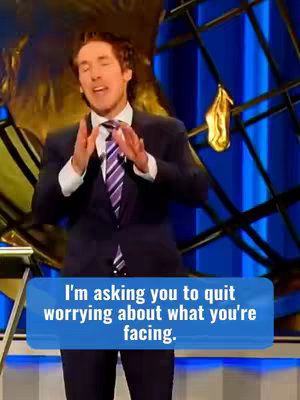 A man in a dark suit with a purple striped tie stands in front of a blue and gold background. He is speaking with his hands raised, and a text box at the bottom says, "I'm asking you to quit worrying about what you're facing."