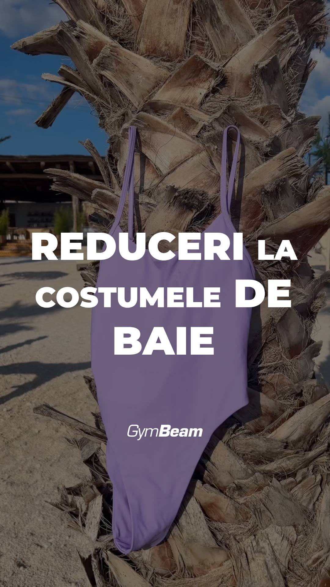 The image features a close-up of a palm tree trunk with a purple swimsuit overlayed. Above the swimsuit, the text reads 'REDUCERI LA COSTUMELE DE BAIE' in a bold, white font. The background depicts a clear sky and possibly a hint of a beach setting.