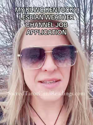 A woman with blonde hair is wearing large sunglasses and looking at the camera. The background shows blurred trees. Text overlays read "MY KLWC KENTUCKY LESBIAN WEATHER CHANNEL JOB APPLICATION."