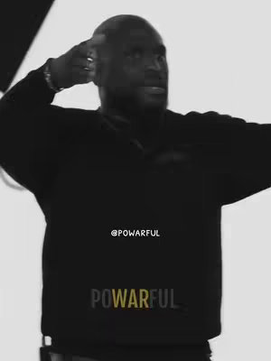 A black and white image featuring a man in a black sweater, gesturing with his hand towards his head against a bright background. Text overlays include the word 'POWERFUL'.