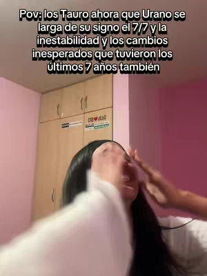 The image shows a person close-up, with a blurred foreground of a white shirt. Their hands are near their face. Above, text in white overlay indicates the video's topic.