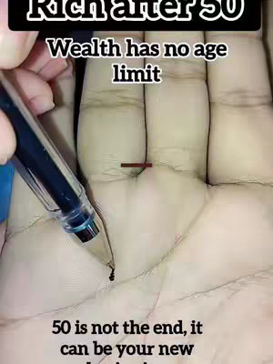 The image shows an open palm with lines, with a pen about to draw a line.  Text overlays indicate a focus on wealth and astrology.