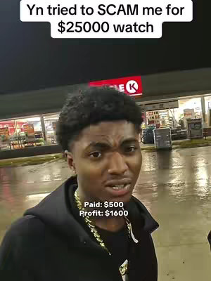 A young Black man is the central focus, standing outdoors near a Circle K gas station. He's wearing a black hoodie and a gold chain, looking at the camera with a slightly concerned expression. Above him, text announces a scam attempt related to a watch. At the bottom, text displays financials: "Paid: $500, Profit: $1600". The background includes the Circle K store and a wet, reflective surface, indicating rain.