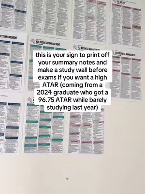 The image shows a wall covered with printed notes, primarily in shades of black, white, and teal. A rectangular text overlay in a white box provides advice about utilizing the study notes. The overall composition focuses on the organization of study materials, suggesting a tip for exam preparation.