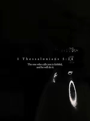 The image is a minimalist, dark-themed composition. The background is a deep black, providing a stark contrast. In the lower part of the image, there's a blurry, reflective shape that seems to be from a glass or bottle, with light illuminating the surface. Centered towards the top is white text, displaying a Bible verse and reference. The overall composition is simple and elegant, with high contrast between the dark background and the white text. The light reflections add a subtle visual interest.