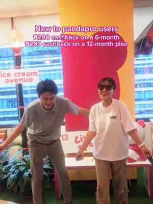 Two people, a man and a woman, stand in a bright indoor setting with a bench and a sign. Text overlays the image, promoting a cashback offer for new pandapro users.
