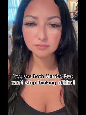 A selfie-style vertical image featuring a woman looking directly at the camera with a somber expression. Her dark hair frames her face. Text overlay in the lower half reads "You are Both Married but can't stop thinking of him!"