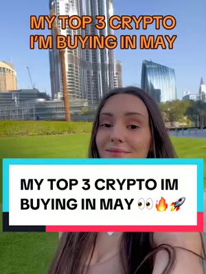 A selfie-style image featuring a woman smiling at the camera, with a cityscape in the background. Two text overlay bars are added, and the main one says "MY TOP 3 CRYPTO I'M BUYING IN MAY" adding in fun emoticons like fire and a rocket ship at the end.
