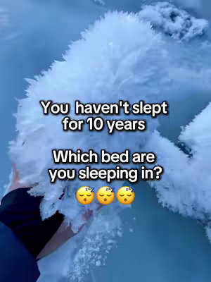 An overhead shot depicts a hand holding a mass of white, textured material. Text overlays read "You haven't slept for 10 years", followed by "Which bed are you sleeping in?" with three sleeping face emojis.