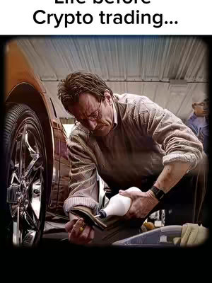 An image showing a man in glasses working on a car. The man is wearing a long-sleeve shirt and appears focused on the task at hand.