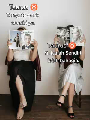 Two women are positioned with a plain white backdrop. Both hold magazines, obscuring most of their faces, and are dressed in contrasting outfits. One woman has a blazer draped on her shoulders and a split black skirt. The other woman is in a silvery outfit. Text overlays provide commentary about the Taurus zodiac sign.