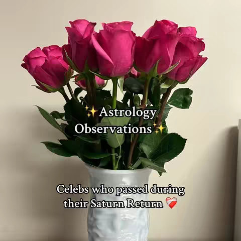 A photograph of a bouquet of bright pink roses in a white vase. Text overlays the image, indicating the video's content about astrology and Saturn Return.