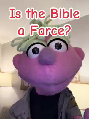 A colorful image featuring a puppet with a large pink face, green hair, and large black eyes. Red text is overlaid on the image.
