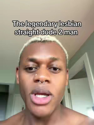 A selfie-style video cover features a young Black man centered in the frame, looking at the camera. He has short, light-colored hair and a nose ring. The background is a plain, light-colored wall. Text overlay at the top reads 'The legendary lesbian straight dude 2 man'