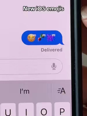 The cover image shows a close-up of a smartphone screen displaying a text message with a blue chat bubble. The message contains three emojis: a worried face, a radish, and a butterfly with hearts instead of antenna. Above the message, the text "New iOS emojis" is displayed. Below the bubble is the word "Delivered" to show the message status. The phone's keyboard and part of the screen is also visible.