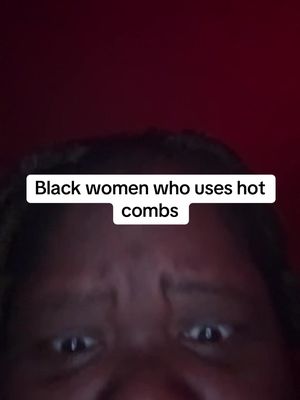 Close-up shot of a Black woman's face, looking directly at the camera. The background is a dark red, with the top of the creator's hair visible. A white text box at the bottom of the frame contains the words 'Black women who uses hot combs'.