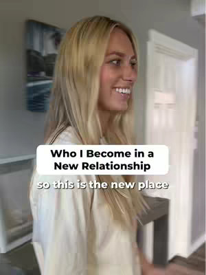A woman with long blonde hair is smiling, looking towards the left. The text overlay is a white box with the words 'Who I Become in a New Relationship', with a smaller text beneath that reads 'so this is the new place'. The background is a slightly blurred, suggesting indoors.