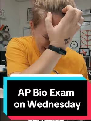 A woman with short blonde hair is shown, with her hand covering her forehead. Below her, a text overlay reads, 'AP Bio Exam on Wednesday,' set against a black and teal background. The overall composition suggests a moment of stress or concern, the woman's hand position and facial expression emphasizing the message of the overlay.