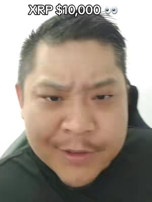 A man with a neutral expression on his face, looking directly at the camera. Above him, text is overlain on the image, and the background is plain.
