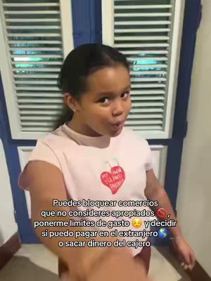 A young, light-skinned girl with black hair is the focal point. She wears a pink t-shirt with a cherry and heart graphic and is mid-pose, lips slightly puckered. Text overlayed on the image offers details about the app, Pixpay, and its features.