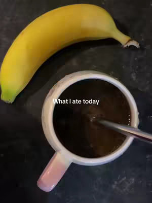 The cover image shows a top-down view of a yellow banana, a white and pink mug, and liquid in the mug with a metal stirrer. The text "What I ate today" is overlaid on the mug.