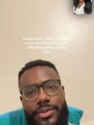 A selfie-style video with a man in the foreground, wearing glasses and a blue shirt. He is looking into the camera with a slight smile and is positioned to fill the lower end of the screen. Above him, in the top right corner, is a small video call window featuring a woman. Text overlayed on the background of the shot reads, "Respectfully, the Lord knows l could only handle being in a LDR relationship with my man..."
