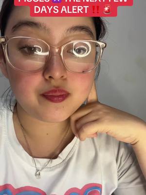 A selfie-style shot features a woman with clear glasses who is taking a selfie. She has fair skin, red lipstick, and her hand is placed on her cheek, with a look that suggests reflection or contemplation. Overlay text provides context.