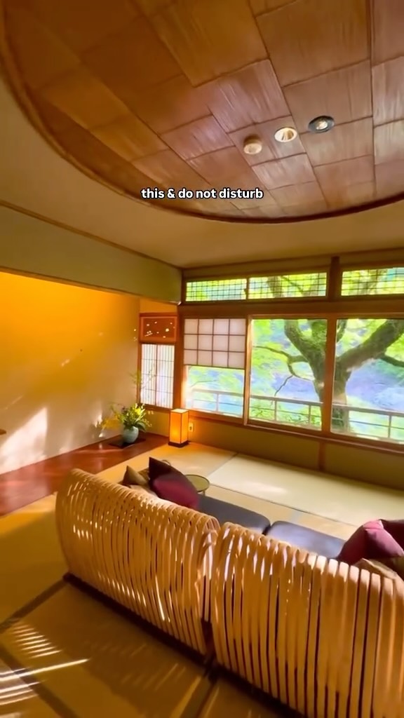 The cover image is a medium shot of a serene Japanese-style interior. The room features a warm color palette with dominant hues of beige, brown, and gold. A large window with white paper screens is visible, showing a lush green outdoor scene. The space includes tatami mats on the floor and a low, curved bamboo couch. The ceiling is a light brown, segmented wood panel with circular accents. Text overlays reading 'this & do not disturb' are located at the top of the image. The overall composition suggests a luxurious and tranquil environment.