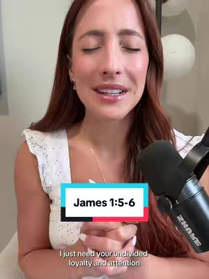 A woman with long auburn hair is facing the camera with her eyes closed. A text box with "James 1:5-6" is overlayed on her. She\'s wearing a white sleeveless shirt and a microphone is visible in front of her. Behind her are some white decorative balloons.
