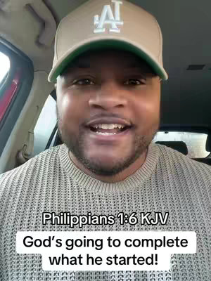 A man in a beige cap and gray sweater smiles at the camera while seated in a car. Text overlays at the top and bottom read "Philippians 1:6 KJV" and "God's going to complete what he started!"