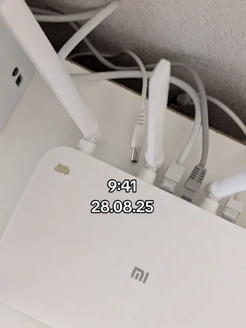 The cover image showcases a white router with several cables and antennas. The router is positioned on a white surface. The time and date "9:41 28.08.25" are added as text overlays.