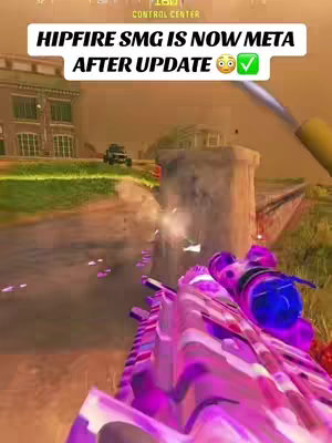 The cover image from a first-person-shooter video game shows the barrel of a brightly colored gun, primarily pink and purple, pointed towards the bottom of the frame. The top of the frame gives a view of a more distant urban environment. The background includes buildings and a distant vehicle. Text overlays in white are located at the top of the image, describing the current game meta.