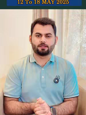 A medium shot shows a man in a light blue polo shirt seated on a couch with light background. The man has dark hair, a trimmed beard, and is looking at the camera. Above him, a banner displays the text '12 To 18 MAY 2025'.