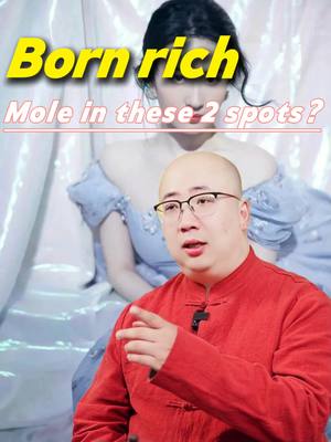 The cover image features a male creator in the foreground, wearing glasses and a red shirt, with a blurred background of a woman in a light blue dress. Text overlays read "Born rich" and "Mole in these 2 spots?"