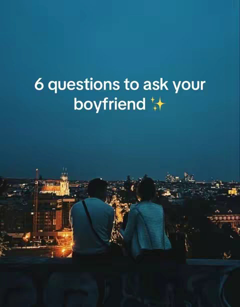 A nighttime cityscape with two people, a man and a woman, sitting on a ledge overlooking the illuminated buildings. Text overlayed with "6 questions to ask your boyfriend".