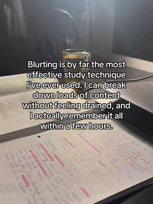 A photo taken from an angle above a desk with open books and notes. A glass of liquid, possibly tea or coffee, sits on the desk at the top of the frame. Handwritten notes filled with text and highlighted phrases cover the pages of the open book. The image overall suggests a study environment, complemented by the text overlay.