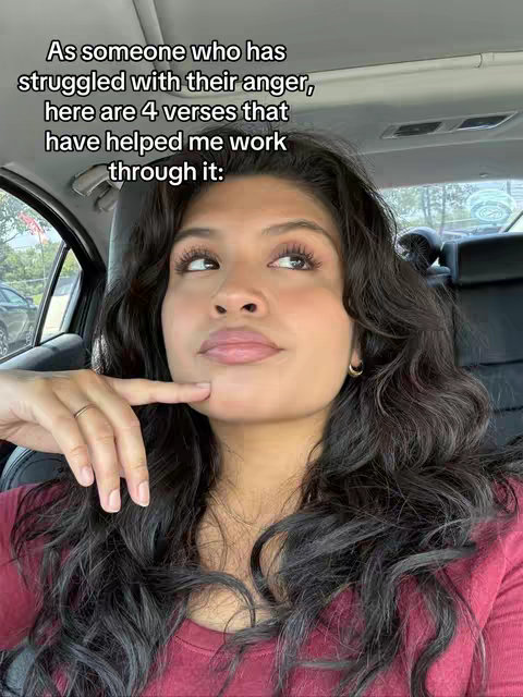 A woman is seated in a car, looking upwards with a slightly pensive expression. Text overlays the image, indicating the content is about anger and verses. The background is a blurred view of a parking area.